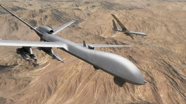 İki Uav dronu bir keşif görevinde çölün üzerinde uçuyor.