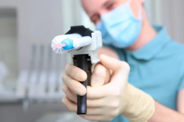 Dentist Takes Aim Camera Lens Dispenser Gun Face Unrecognizable Copy — Stock Photo, Image