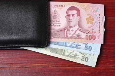 M-cüzdanda bulunan siyah Tay para 