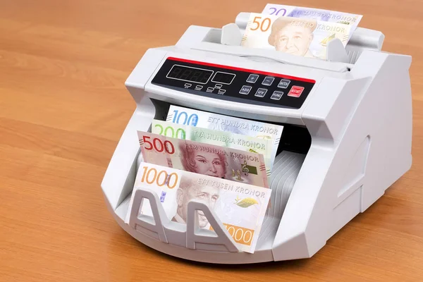 Swedish money in a counting machine