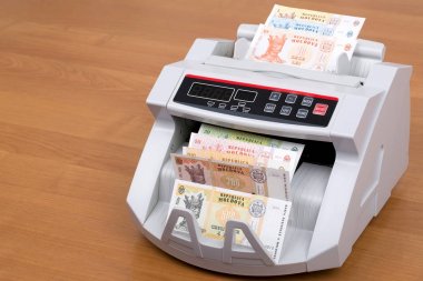 Moldovan leu in a counting machine  clipart