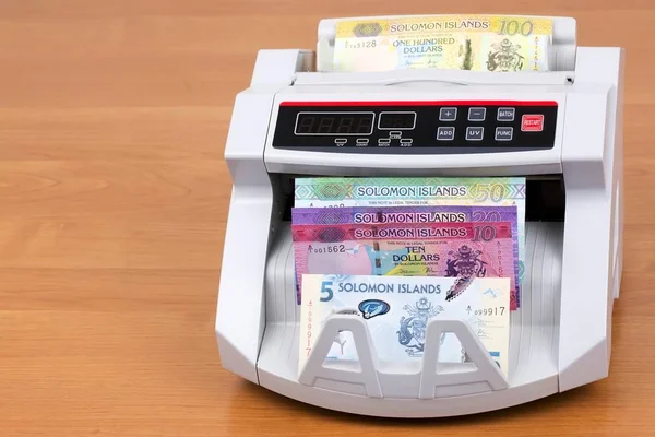 Solomon Adaları Dolar bir sayma makinesinde