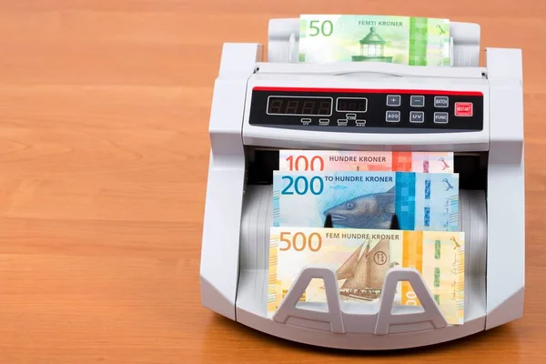 Norwegian krone in a counting machine