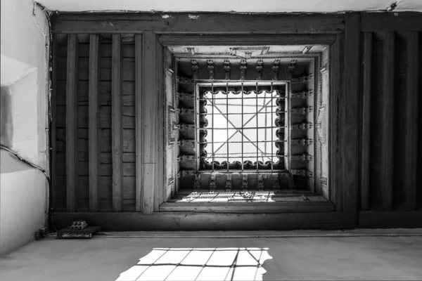 Ceiling with grid and sky view