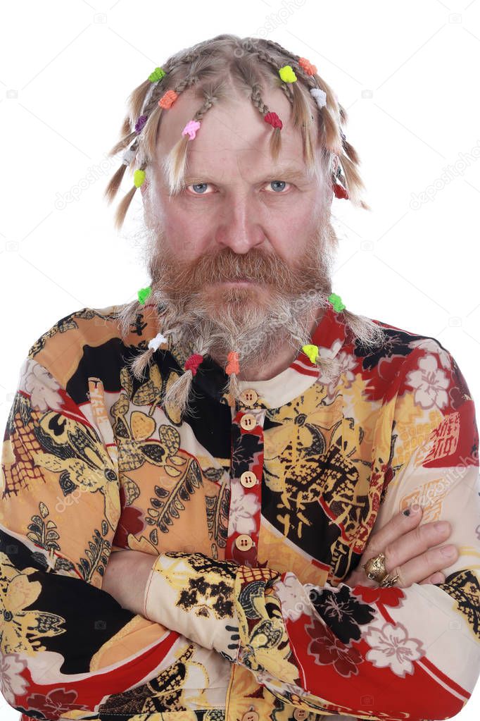 close-up portrait of a man with braids, mustache and beard in colored shirt on a white background studio