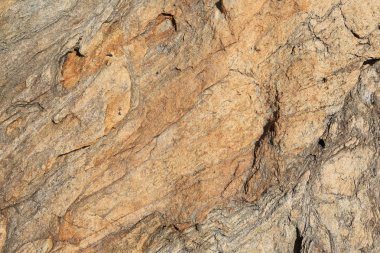 Güneş ışığında izole edilmiş makro doku kıyı kayalıkları