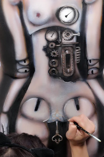 close-up of a woman\'s body painting, marionette doll with a mechanism on a black background Studio