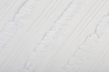 fırfırlı beyaz kumaş parçasının makro dokusu