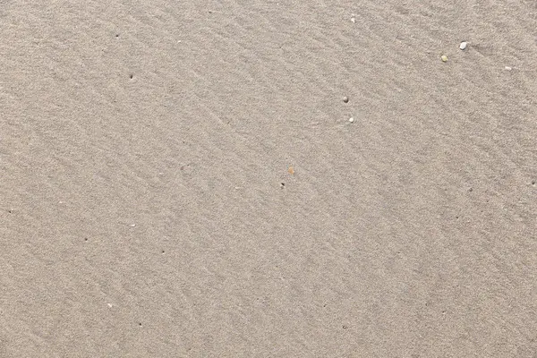 Desenhos e pegadas na areia — Fotografia de Stock