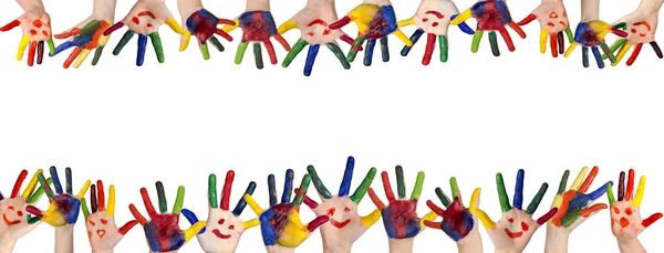 stock image Children's smiling colorful hands raised up. The concept of clas