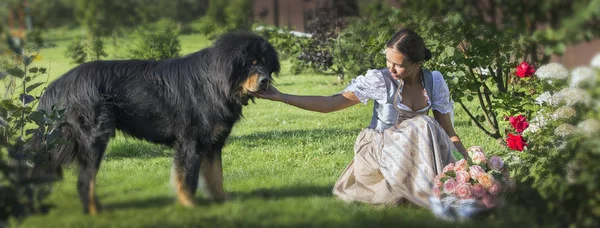 girl  holding a dog