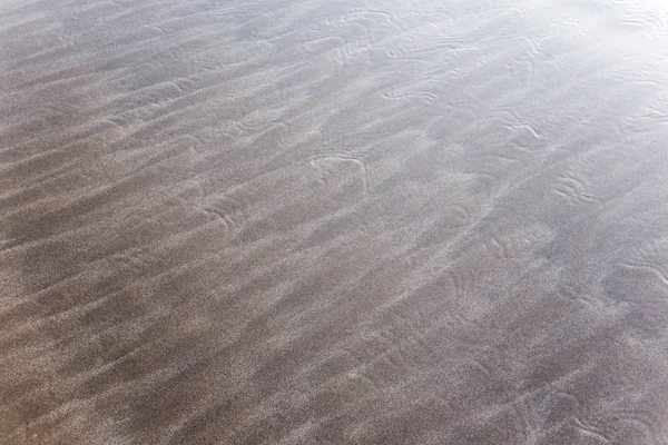 Dessins et empreintes dans le sable — Photo