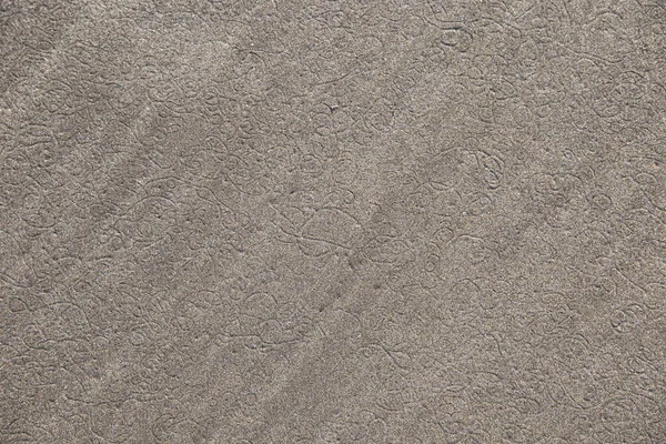 Desenhos e pegadas na areia — Fotografia de Stock