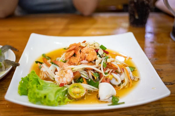 Hot Spicy Seafood Papaya Salad White Ceramic Plate Wooden Table — Stock Photo, Image