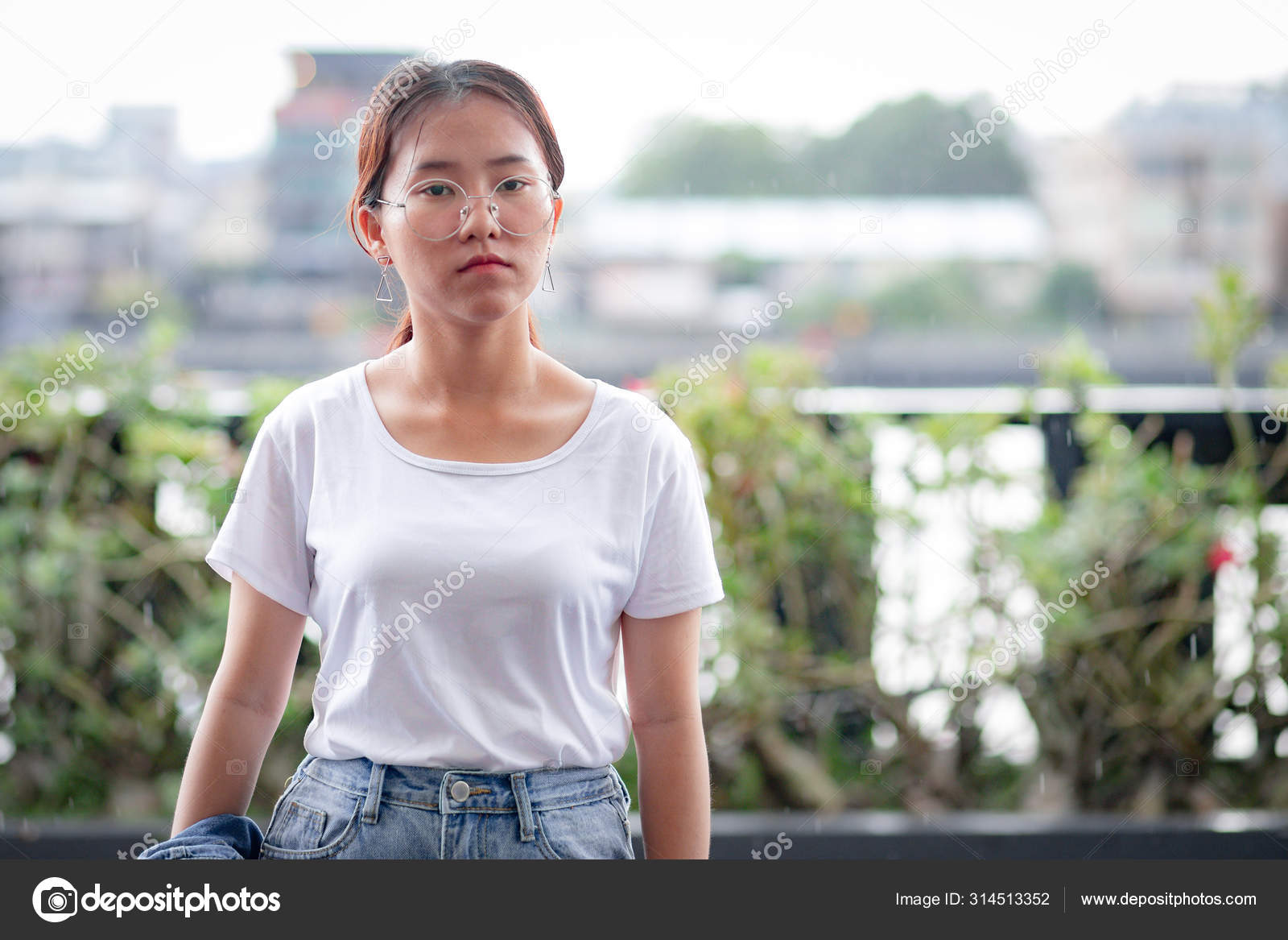 white t shirt and ripped jeans