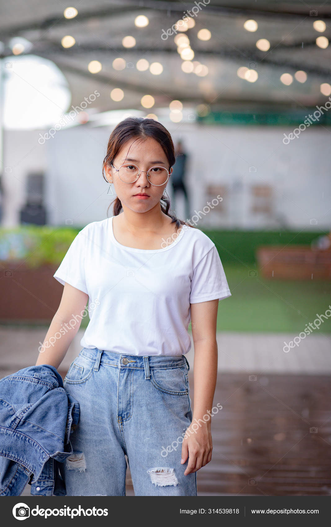 white t shirt and ripped jeans