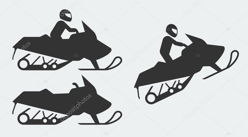 Snowmobiling silhouettes on gray background