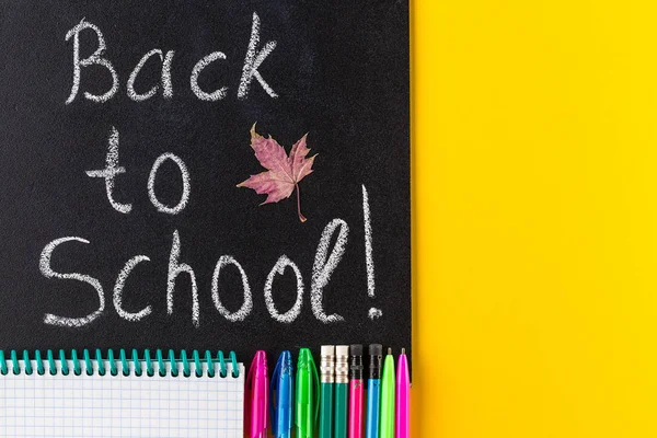 Back to School Text. School Stationary on yellow background.