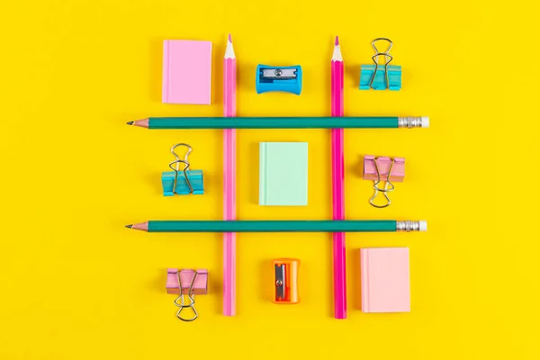 School pencils on yellow background with School supplies. Minimal concept art. Creative flat lay top view back to school concept with stationery