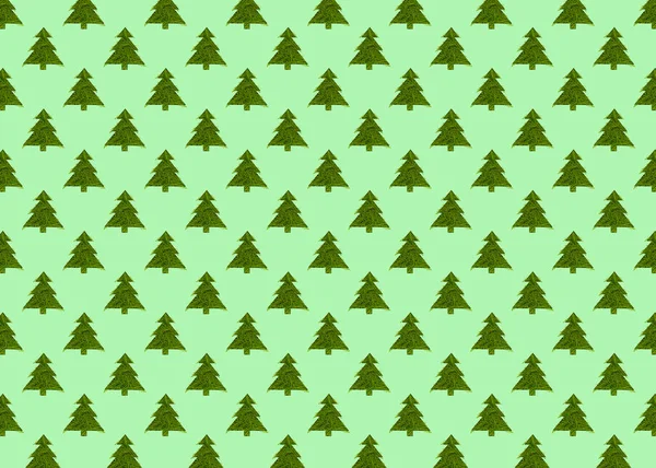 Бесшовный узор с зелеными рождественскими деревьями на зеленом фоне. — стоковое фото