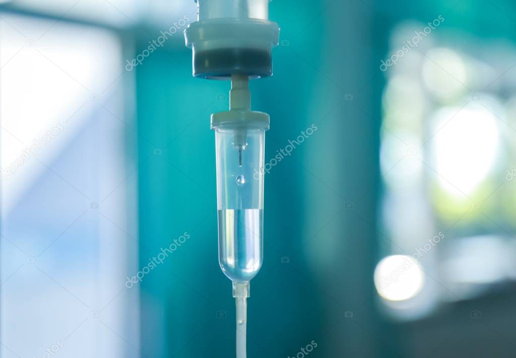 Set iv fluid intravenous drop saline drip hospital room,Medical Concept,treatment emergency and injection drug infusion care chemotherapy, concept.blue light background,selective focus 