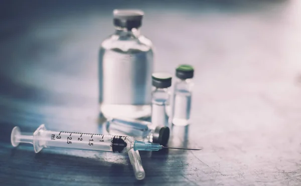 Aşı Coronavirus deverlopment şişe doz grip iğne şırıngası, tıbbi konsept enjeksiyon enjeksiyon enjeksiyonu hastalık tedavi tedavisi hastane aşı önleme hastalığı.