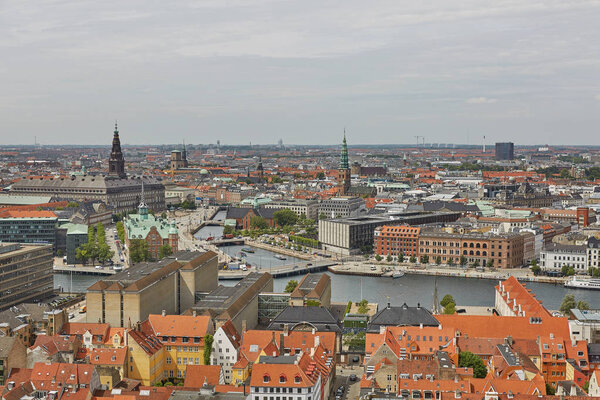 Skyline of scandinavian city of Copenhagen in Denmark during a cloudy day.