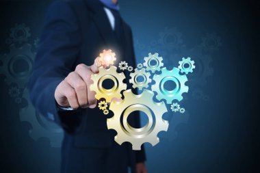 Dişli çarkları başarı kavramı için gösterilen işadamı  