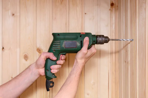 Man Hands Hold Drill Drill Wooden Wall — Stock Photo, Image