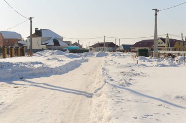 March 7, 2015: Snowy rural street in early spring. Village Siatrakasy. Chuvash Republic. Russia.