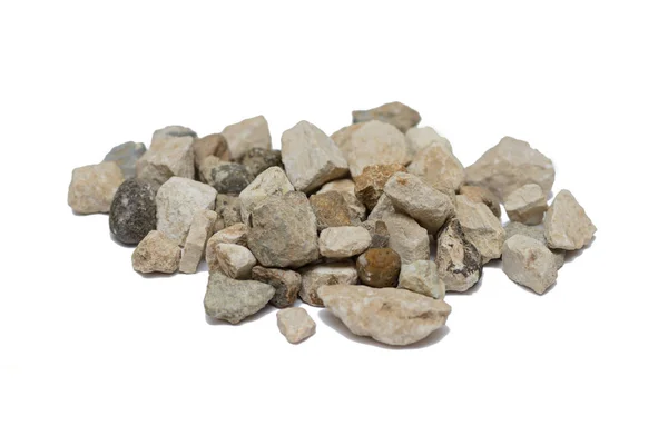 Haufen unterschiedlicher Steine liegen auf weißem Hintergrund — Stockfoto