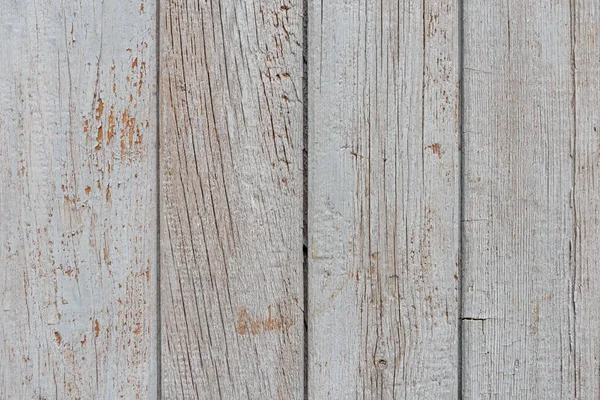 Tableros verticales de madera vieja con pintura gris pelada — Foto de Stock