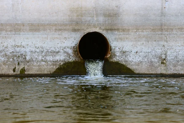 Rusty sewer pipe with water leaking into the reservoir