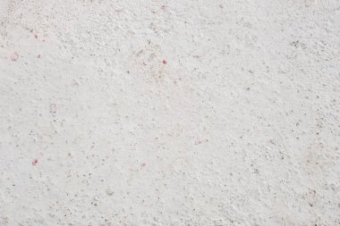 Beyaza boyanmış eski bir beton duvarın soyut arkaplanı.