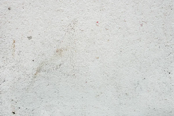 Beyaza boyanmış eski bir beton duvarın soyut arkaplanı.