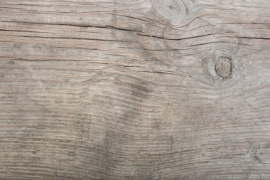 Eski ahşap tahtanın soyut arkaplanı ve belirgin bir yapısı var.