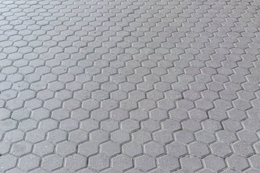 Bir parktaki altıgen beton fayansların soyut arkaplanı