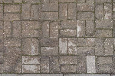 Parkın yakınındaki bir yolda eski bir çimento fayansının soyut arkaplanı