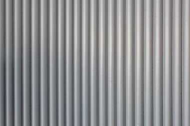 Kabartmalı gri bir plastik yüzeyin soyut arkaplanı