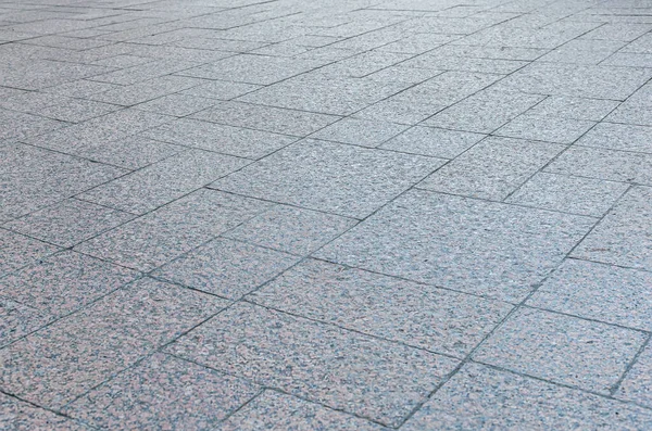 Granit kiremitlerle kaplı bir kaplamanın soyut arkaplanı 