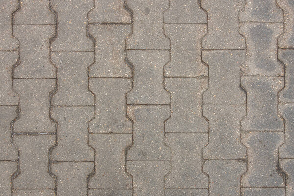 Abstract background of an old tiles on the track in the park close up