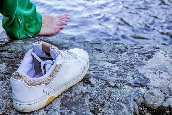 Pulled off sports shoe by the river, Hemsedal, Norway.