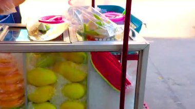 Khon Kaen Province Isan Thailand 05. November 2018 Small stall fruits fruits bar stand and street food with glass box in Khon Kaen District Isan Northeast Thailand in Southeast Asia.