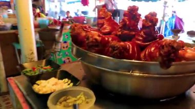 Khon Kaen Province Isan Thailand 02. November 2018 Disgusting fresh meat pork and butcher on Thai food market shop in Khon Kaen District Isan Northeast Thailand in Southeast Asia.