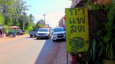 Khon Kaen Province Isan Thailand 01. November 2018 Walking by the busy city life cityscape people buildings cars heavy traffic jam rush hour panorama view on street road highway in Khon Kaen Thailand.
