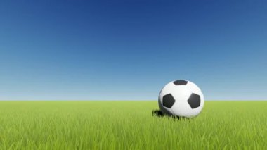 Yeşil çimlerde futbol topu