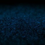 Abstract motion background shining blue particles stars sparks wave movement loop