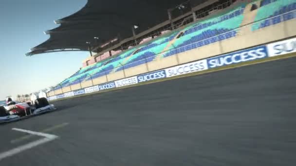 F1 racecar speeding along home stretch — ストック動画