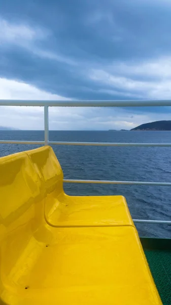 Empty yellow  seats on the ferry