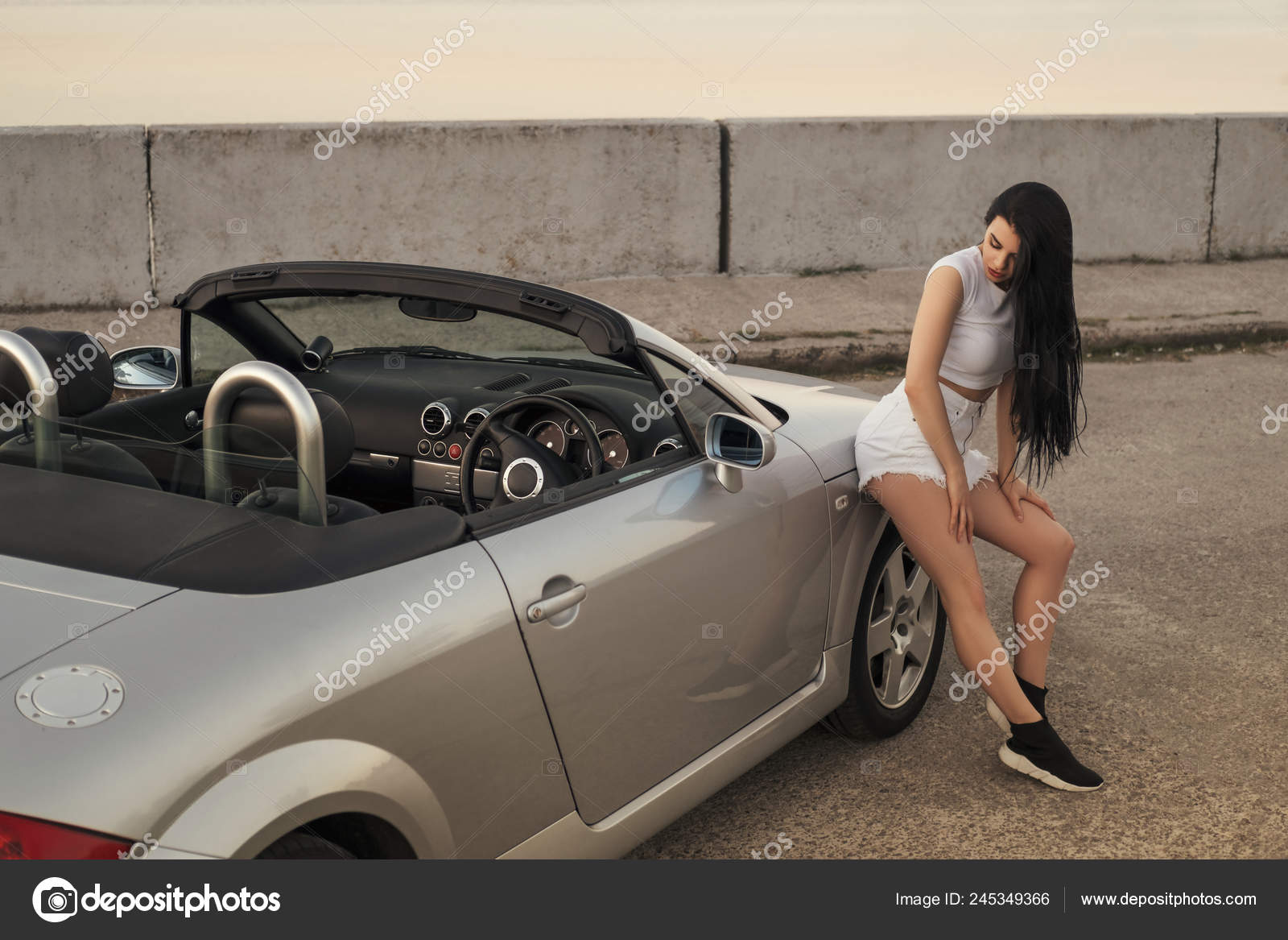 Sexy girl pushing car